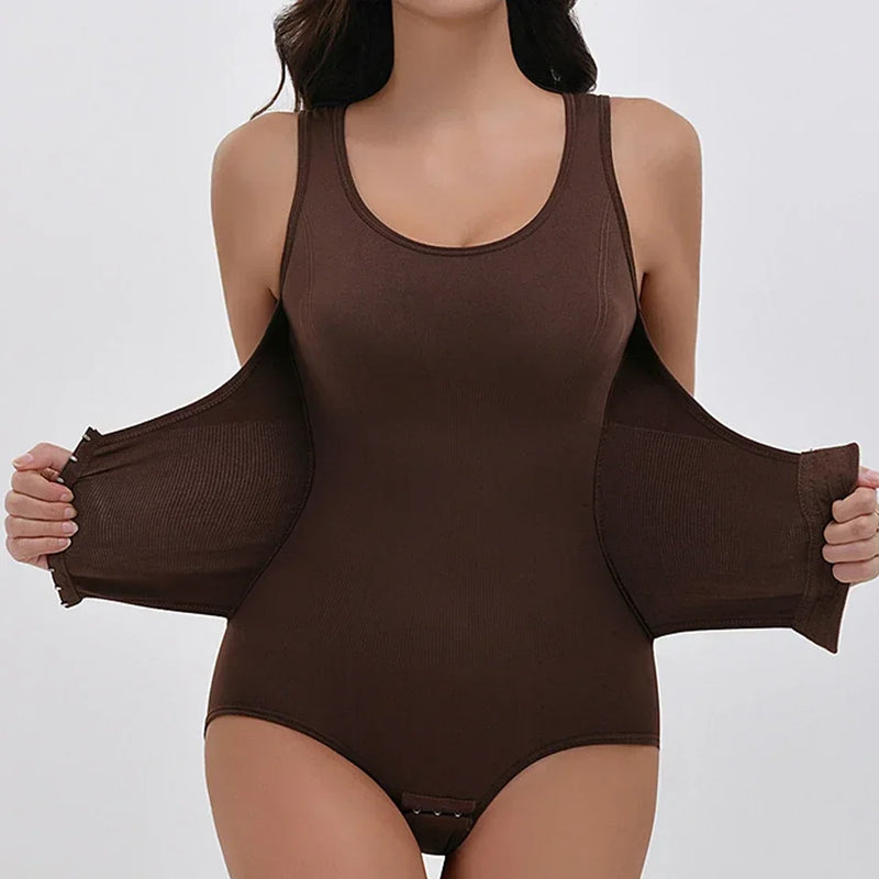 Woman wearing a brown scoop-neck bodysuit, holding the ribbed waist fastening panels open.
