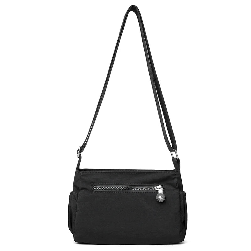 Women's Lightweight Water-Resistant Nylon Crossbody Bag | Front Zip Pocket | Adjustable Strap | Casual Everyday | Black · Burgundy · Pink · Beige